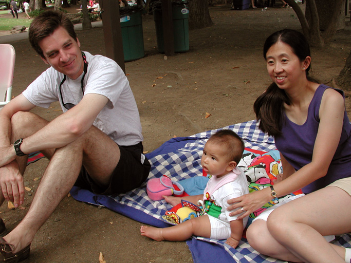Carl, Maya, and Rebecca at a July 4th picnic