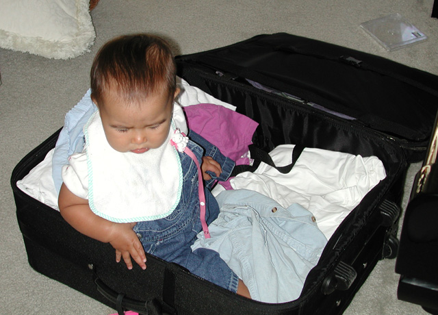Maya is big enough now to pack herself 