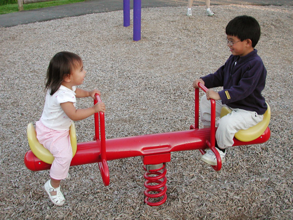 Maya and Austin teeter totter together