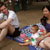 Carl, Maya, and Rebecca at a July 4th picnic