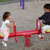 Maya and Austin teeter totter together